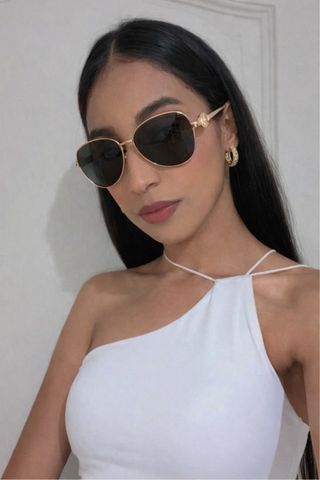 Gafas de sol doradas y negras Versace