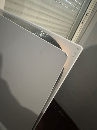 Consola PS5 con mando y auriculares