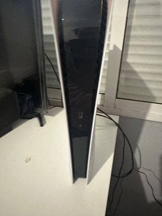 Consola PS5 con mando y auriculares