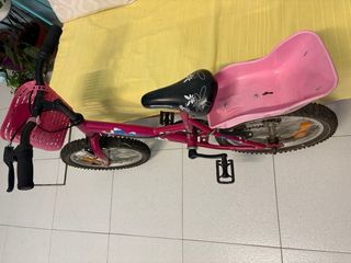 Bicicleta niña rosa con cesta y asiento trasero