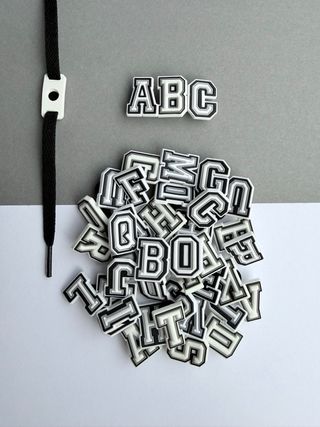 Pines/Dijes Zapatillas Letras Tipo Crocs