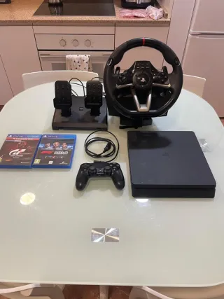 PS4 + Controller + Steering Wheel + 2 Games