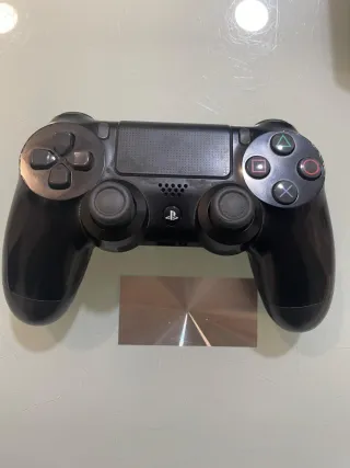 PS4 + Controller + Steering Wheel + 2 Games