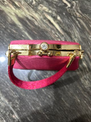 Bolso de fiesta fucsia y dorado