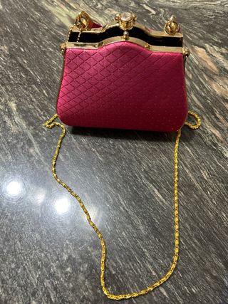Bolso de fiesta fucsia y dorado