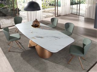 Mesa comedor ovalada porcelánico y acero bronce