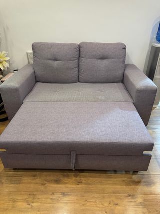 Sofá cama gris de tela