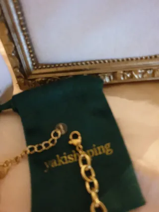 Pulsera dorada con charms marinos