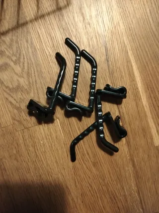 Accesorios para rejillas de pared negros