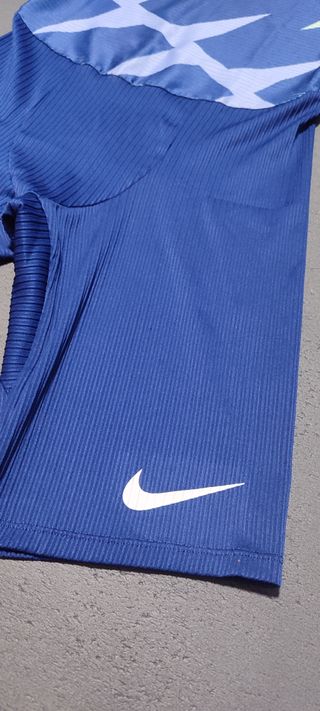 Mono Nike atletismo azul y verde elite