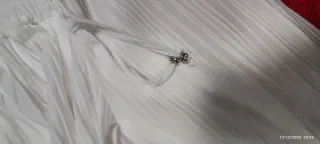 Pantaloni bianchi a gamba larga plissettati