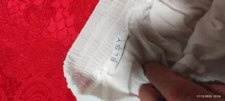 Pantaloni bianchi a gamba larga plissettati