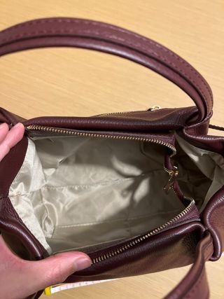 Bolso de piel burdeos sin usar