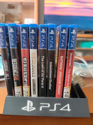 Lote 8 Videojuegos PS4 más soporte para colocarlos