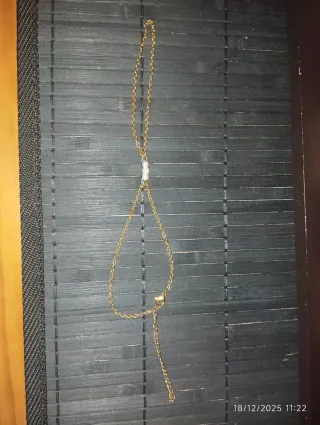 Pulsera de mano acero dorado con perlas