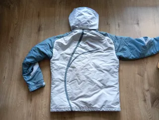 Chaqueta Quechua impermeable azul y gris claro