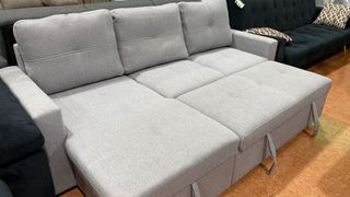 Sofá cama gris y negro de tela