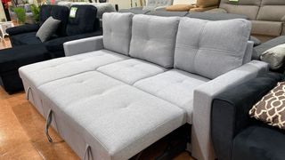 Sofá cama gris y negro de tela