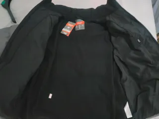 Chaqueta de plumas gris y negra sin estrenar