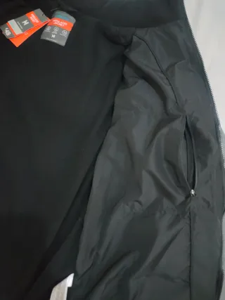 Chaqueta de plumas gris y negra sin estrenar