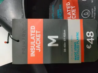 Chaqueta de plumas gris y negra sin estrenar
