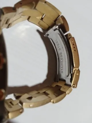 Reloj Swatch Dorado y Plateado