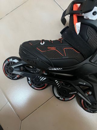 Patines en línea Oxelo negros y naranjas un uso