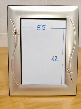 Portafotos plateado con estrellas