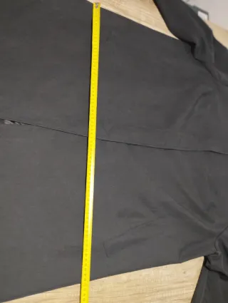 Gabardina negra talla XXXL.
