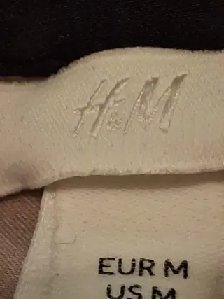 Camisa de rayas beige y negra