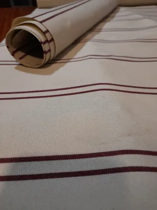 Tela toldo a rayas beige y rojo