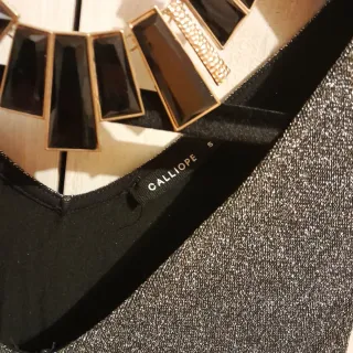 Tuta intera glitterata argento e nera più collana