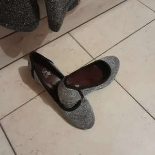 Tuta intera glitterata argento e nera più collana