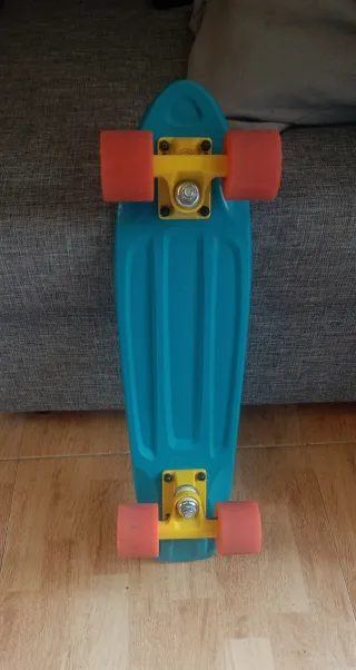 Skate Penny Azul con Ruedas Naranjas