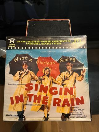 Súper 8 Cantando bajo la lluvia, y Americano París