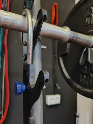 Barra con pesas de discos para gimnasio