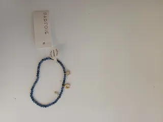 Pulsera Parfois azul y dorada