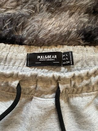 Pantalón chándal gris con cremallera