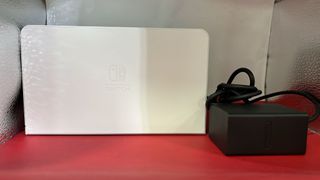 Nintendo Switch OLED + funda + caja