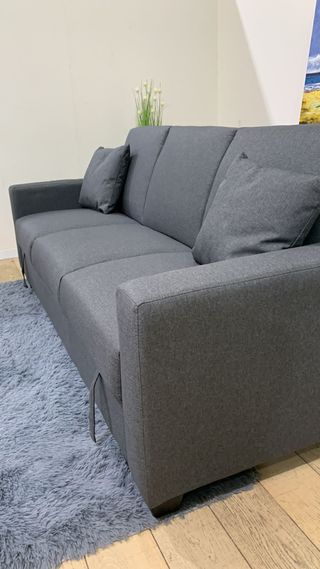 Sofá cama gris con arcón