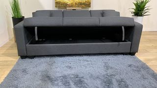 Sofá cama gris con arcón
