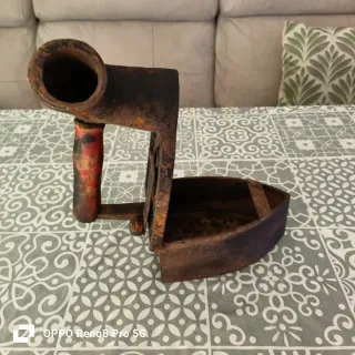 Plancha antigua de hierro fundido