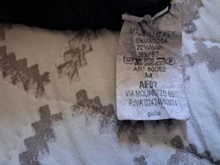 Jersey y blusa de punto acanalado negra de cuello