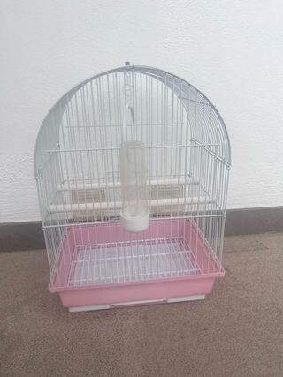 Jaula para pájaros rosa y blanca