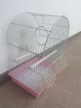 Jaula para pájaros rosa y blanca