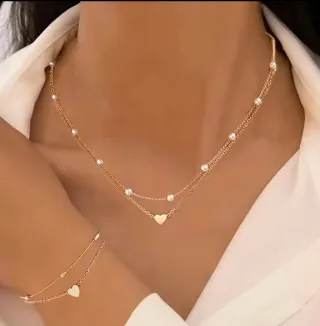 Conjunto collar y pulsera corazón dorado