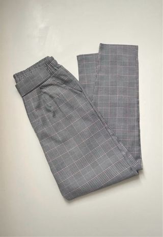 Pantaloni a quadri grigi e rosa
