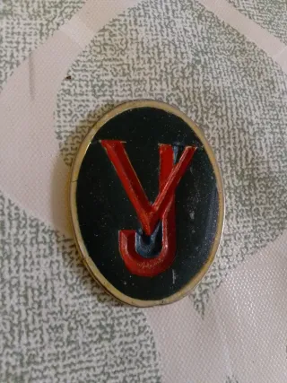 Antigua insignia VJ