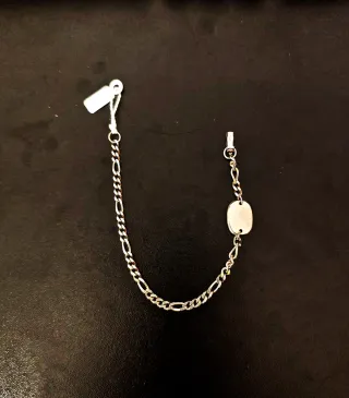 Pulsera Figaro de plata con Placa Ovalada