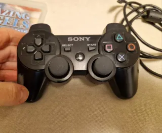 PS3 Super Slim Nera + Gioco e Accessori